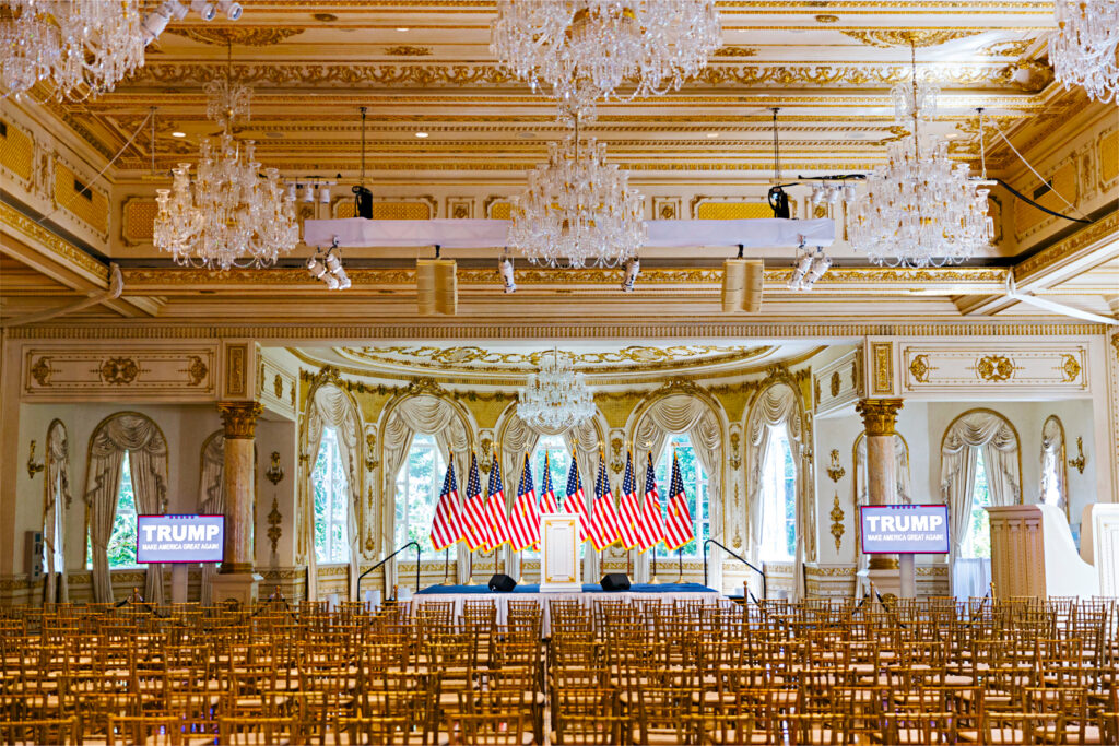 A large room with many chairs and chandeliers